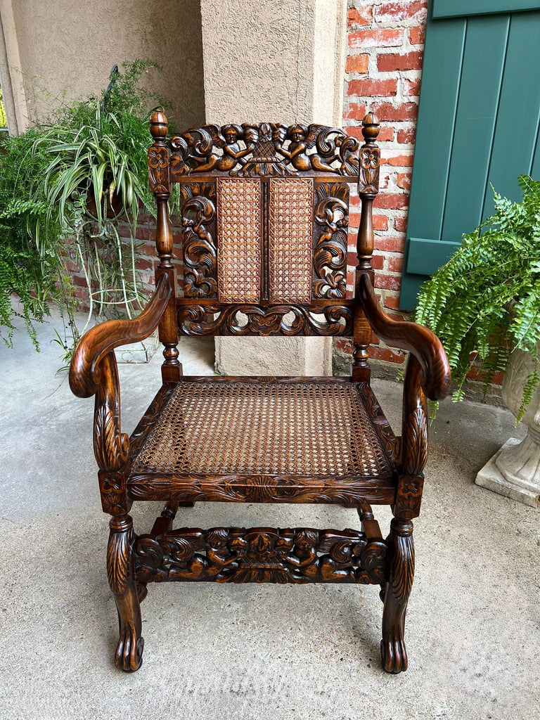 Antique English Arm Chair Carved Oak Cane Seat Renaissance Cherubs Fireside