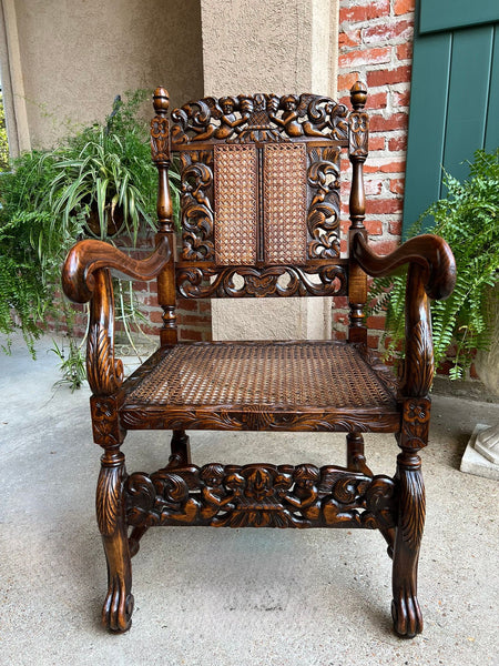 Antique English Arm Chair Carved Oak Cane Seat Renaissance Cherubs Fireside