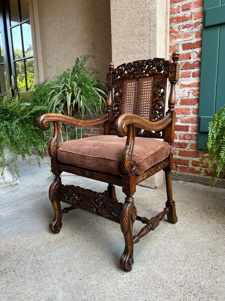 Antique English Arm Chair Carved Oak Cane Seat Renaissance Cherubs Fireside