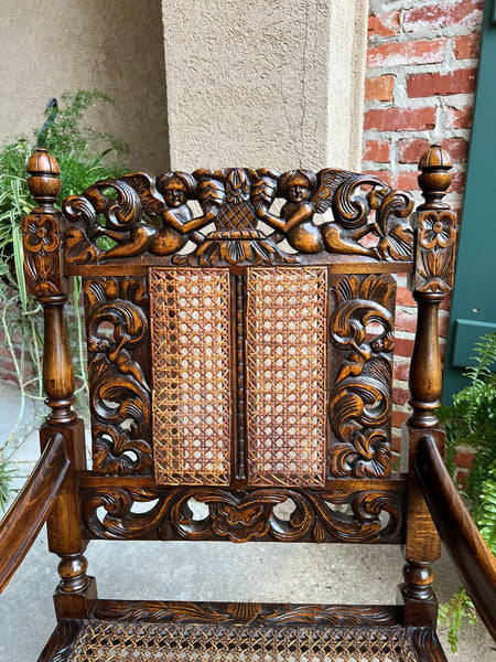 Antique English Arm Chair Carved Oak Cane Seat Renaissance Cherubs Fireside
