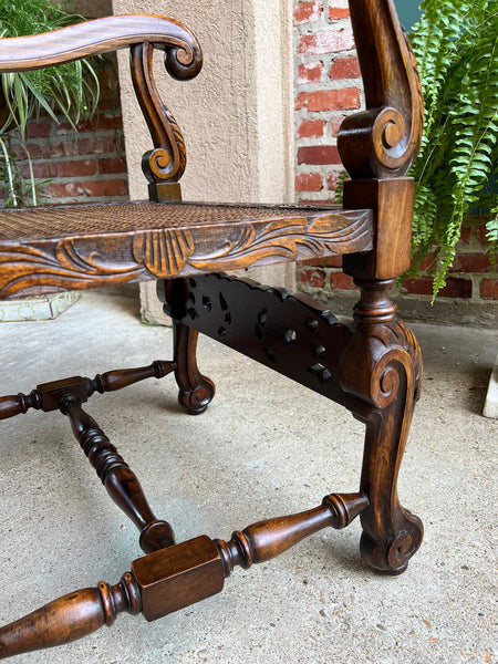 Antique English Arm Chair Carved Oak Cane Seat Renaissance Cherubs Fireside