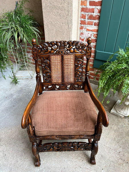 Antique English Arm Chair Carved Oak Cane Seat Renaissance Cherubs Fireside