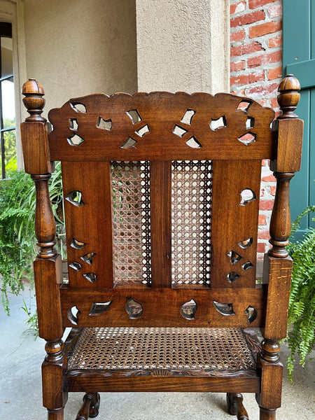 Antique English Arm Chair Carved Oak Cane Seat Renaissance Cherubs Fireside