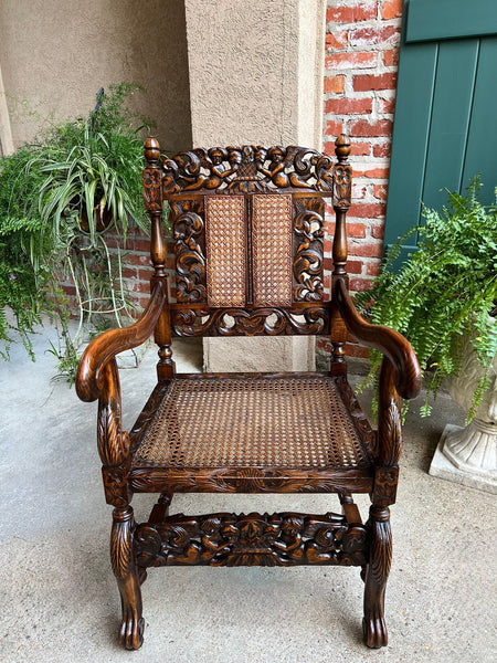 Antique English Arm Chair Carved Oak Cane Seat Renaissance Cherubs Fireside