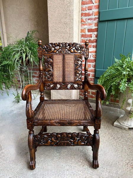 Antique English Arm Chair Carved Oak Cane Seat Renaissance Cherubs Fireside