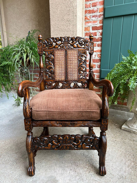 Antique English Arm Chair Carved Oak Cane Seat Renaissance Cherubs Fireside