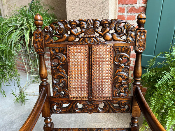 Antique English Arm Chair Carved Oak Cane Seat Renaissance Cherubs Fireside