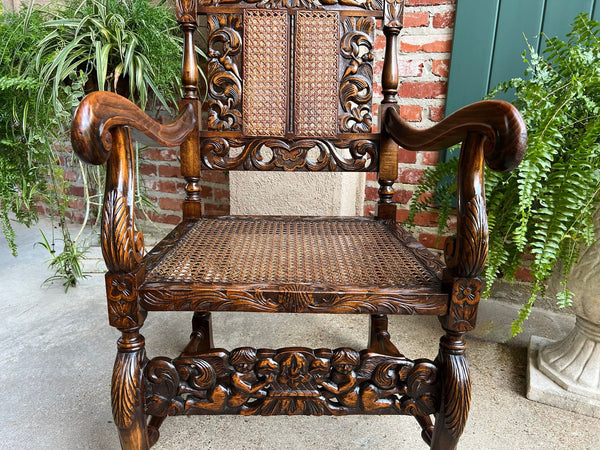 Antique English Arm Chair Carved Oak Cane Seat Renaissance Cherubs Fireside