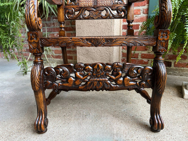 Antique English Arm Chair Carved Oak Cane Seat Renaissance Cherubs Fireside