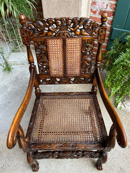 Antique English Arm Chair Carved Oak Cane Seat Renaissance Cherubs Fireside